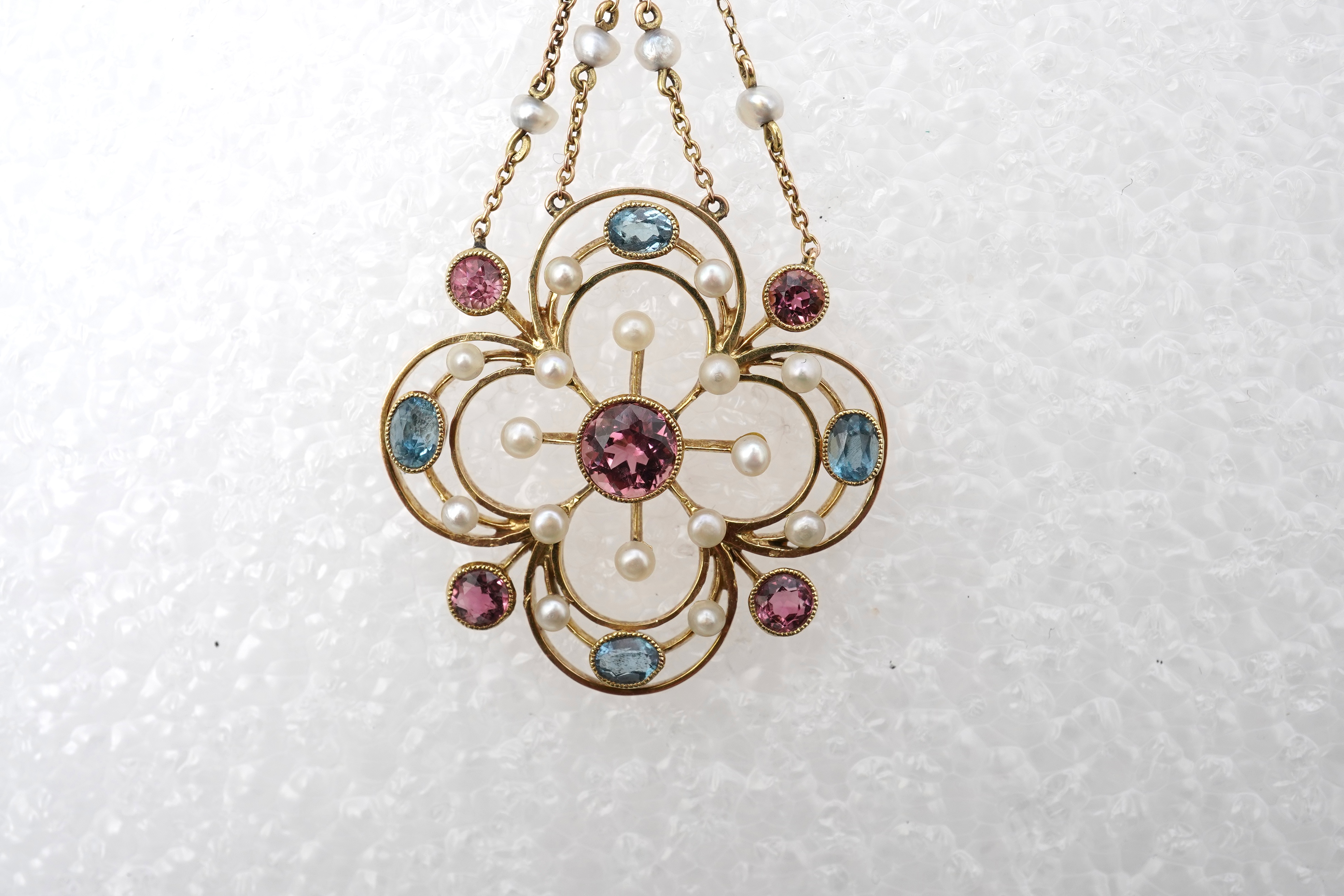 An attractive Edwardian tourmaline and seed pearl pendant, early 20th century